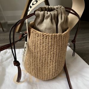 CHLOÉ Woody small leather-trimmed raffia basket bag